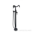 Freestanding bathtub faucet with hand-held spray